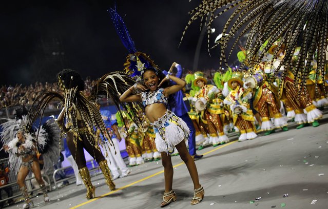 Revellers from Academicos do Tucuruvi Samba School take part in a carnival at Anhembi Sambadrome in Sao Paulo February 14, 2015. (Photo by Nacho Doce/Reuters)