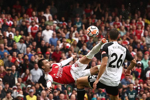 Arsenal's Portuguese midfielder #21 Fabio Vieira jumps for a bicycle kick during the English Premier League football match between Arsenal and Fulham at the Emirates Stadium in London on August 26, 2023. (Photo by Henry Nicholls/AFP Photo)
