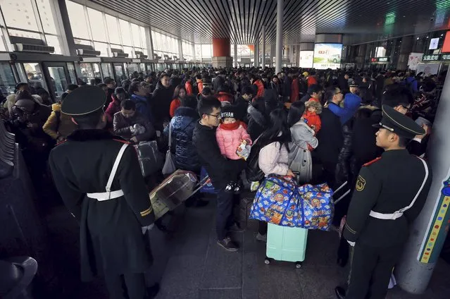 Passengers enter a railway station in Beijing, China, January 30, 2016. (Photo by Reuters/Stringer)