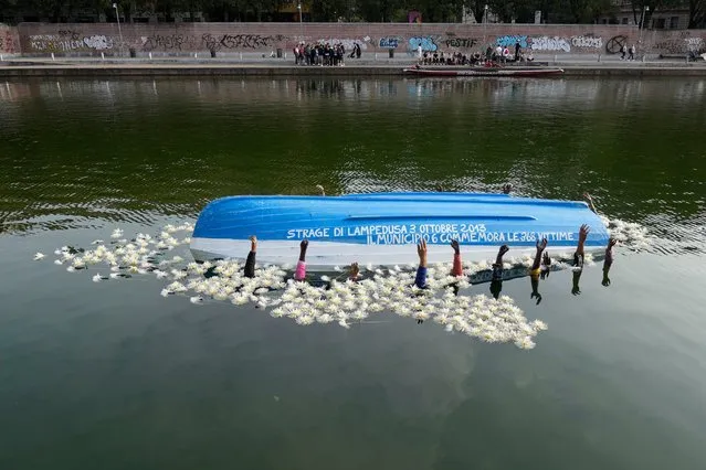 An installation created by the Milan's municipality is displayed at the Darsena del Naviglio canal in memory of a fishing boat packed with some 500 African migrants which capsized in 2013 off the shores of the Sicilian island of Lampedusa, in Milan, Italy, Thursday, October 5, 2023. The enormous scale of the tragedy, which caused 368 dead, became one of the largest death tolls in a migrant shipwreck in the Mediterranean on record. (Photo by Luca Bruno/AP Photo)