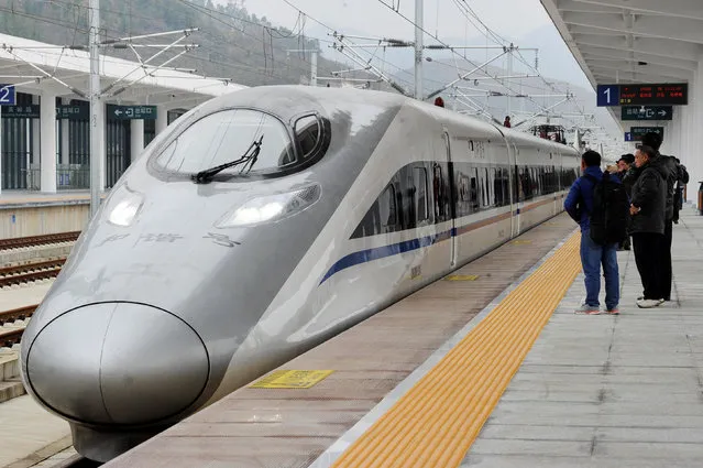 A high-speed railway train linking Shanghai and Kunming, of Yunnan province, is seen at a station during a partial operation, in Anshun, Guizhou province, China, December 28, 2016. (Photo by Reuters/Stringer)