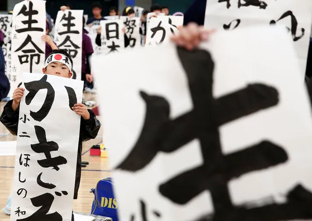Participants show off their writings at a New Year calligraphy contest in Tokyo, Japan, January 5, 2017. (Photo by Kim Kyung-Hoon/Reuters)