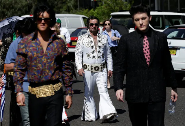 Elvis Presley tribute artists Pete Storm (L) from England and Jake Rowley (R) from the United States arrive alongside Elvis fan Graham Lawrence (C) from Australia's Gold Coast at the Parkes Observatory radio telescope during the 25th annual Parkes Elvis Festival in the rural Australian town of Parkes, west of Sydney, January 13, 2017. (Photo by Jason Reed/Reuters)