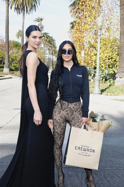 (L-R) American model  Kendall Jenner and American media personality Kim Kardashian attend the Balenciaga Fall 24 Show on December 02, 2023 in Los Angeles, California. (Photo by Stefanie Keenan/Getty Images for Balenciaga)