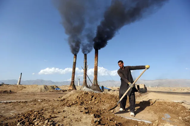 An Afghan day laborer works on the outskirts of Kabul, Afghanistan, Monday, April 20, 2015. Men generally work for eight hours a day, six days a week, and make about 350 Afghani ($6) per day. (Photo by Rahmat Gul/AP Photo)