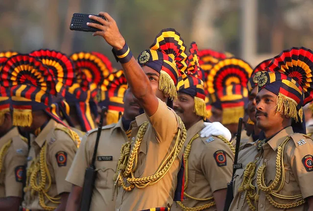 Policemen in ceremonial attire take a selfie photo before the start of a full-dress rehearsal for the Republic Day parade in Mumbai, India January 24, 2017. (Photo by Shailesh Andrade/Reuters)