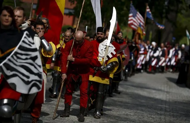 Participants take part in the opening ceremony parade of the Medieval Combat World Championship at Malbork Castle, northern Poland, April 30, 2015. (Photo by Kacper Pempel/Reuters)