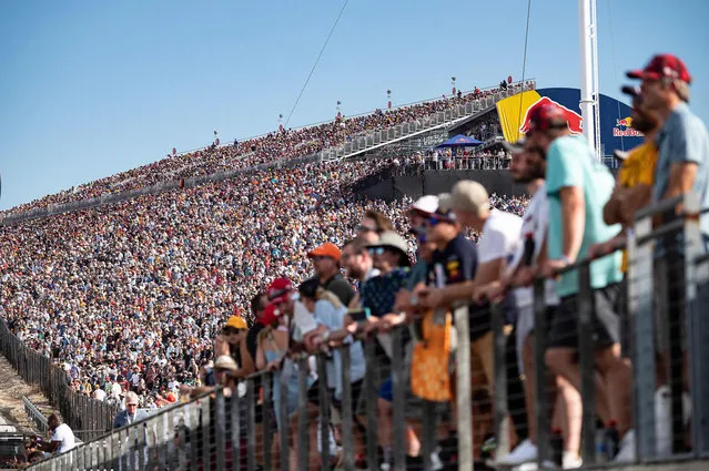 Spectators watch the qualifying session at the Circuit of The Americas in Austin, Texas, on October 23, 2021, ahead of the Formula One United States Grand Prix. (Photo by Jim Watson/AFP Photo)