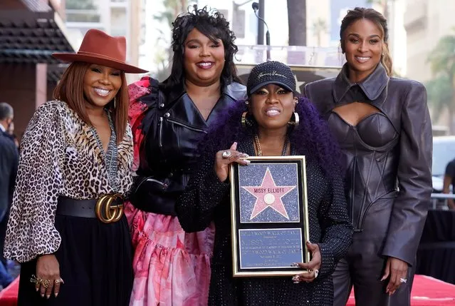 Hip hop artist Missy Elliott, second from right, poses with, from left, manager Mona Scott-Young and singers Lizzo and Ciara at a ceremony to award Elliott a star on the Hollywood Walk of Fame, Monday, November 8, 2021, in Los Angeles. (Photo by Chris Pizzello/AP Photo)