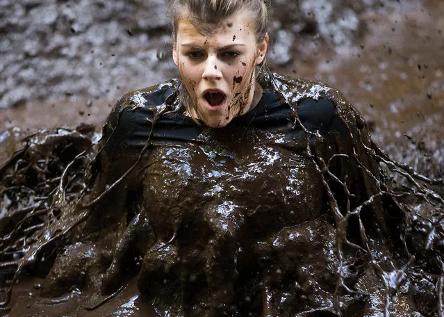 The Muddy Trials race on the Craufurdland estate near Kilmarnock is the world’s muddiest race. Competitors race through deep ditches, woodland trails and river crossings to get to the finishing line, 25 March 2018. (Photo by Michael McGurk/Rex Features/Shutterstock)