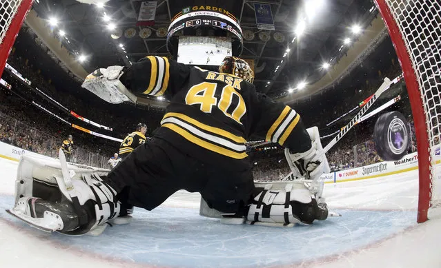 A puck shot by St. Louis Blues' Vladimir Tarasenko, of Russia, sails past Boston Bruins goaltender Tuukka Rask (40), of Finland, for a goal during the second period period in Game 1 of the NHL hockey Stanley Cup Final, Monday, May 27, 2019, in Boston. (Photo by Bruce Bennett/Pool via AP Photo)