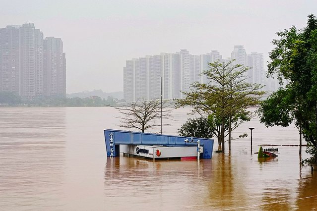 This photo taken on April 22, 2024 shows a submerged building at a flooded park after heavy rains in Qingyuan, in southern China's Guangdong province. (Photo by AFP Photo/China Stringer Network)
