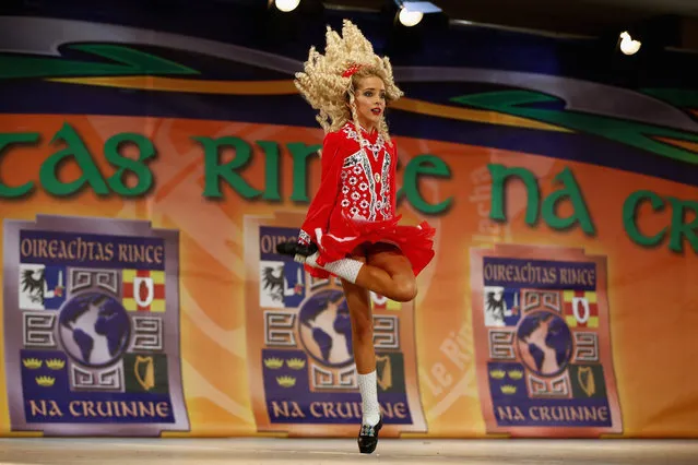 Competitors perform at the World Irish Dance Championship on April 13, 2014 in London, England. The 44th World Irish Dance Championship is currently running at London's Hilton London Metropole hotel, and will host approximately 5,000 dancers competing in solo, Ceili, modern figure choreography and dance drama categories during the week long event. (Photo by Dan Kitwood/Getty Images)