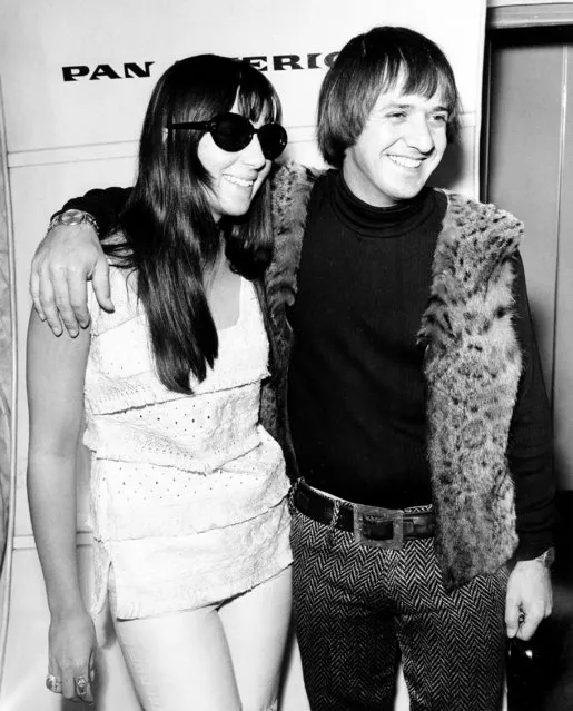 Cher and Sonny Bono pose before boarding a Pan American flight to Hawaii at Los Angeles airport, Ca., on December 7, 1965. (Photo by AP Photo)