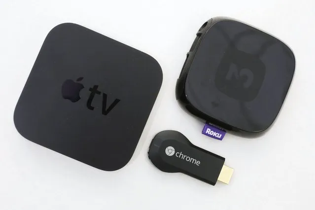 Apple TV started 2007. An Apple TV device, left, is shown alongside Google's Chromecast, center, and the Roku 2, Thursday, December 19, 2013 in New York. Streaming video devices such as Roku, Apple TV and Google’s Chromecast project video from Netflix, YouTube and other services onto the big-screen TV. Suddenly, the computer seems inadequate. Internet television will never be the same. (Photo by Mark Lennihan/AP Photo)