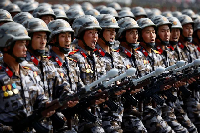 North Korean soldiers march and shout slogans during a military parade marking the 105th birth anniversary of country's founding father Kim Il Sung in Pyongyang, North Korea, April 15, 2017. (Photo by Damir Sagolj/Reuters)