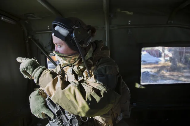 A backup soldier in the jeep prepares to take action at the Terningmoen Camp in Elverum, Norway on March 23, 2017. The unit was started after Norway's Armed Forces' Special Command saw an increased need for female special operations soldiers – particularly in places like Afghanistan where male troops were forbidden from communicating with women. The exclusion of half the population was having a detrimental impact on intelligence gathering and building community relations. (Photo by Carolina Reid/NBC News)