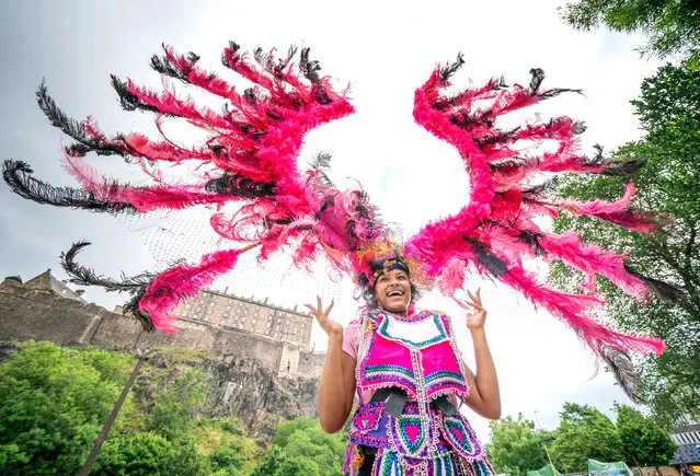 Carnival performer Monique Hendry displays one of the vibrant carnival costumes at the launch of the Edinburgh Festival Carnival 2021 on Wednesday, July 14, 2021 which is set run from Friday July 16 to Sunday July 18. (Photo by Jane Barlow/PA Images via Getty Images)