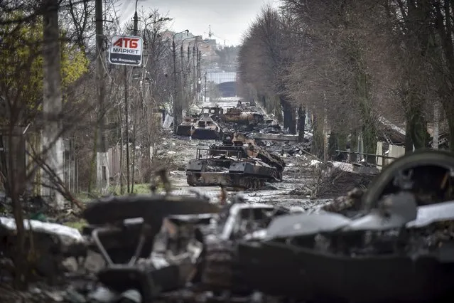 General view of a street with destroyed Russian military machinery in the areas recaptured by the Ukrainian army in the city of Kyiv (Kiev), Ukraine, 02 April 2022. (Photo by Oleg Petrasyuk/EPA/EFE)