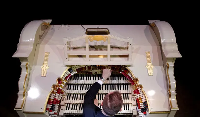 Organist Richard Hill plays a newly restored 1903's American Wurlitzer Theatre Pipe Organ, which is believed to be the largest in Europe, at the Troxy entertainment venue in London, Wednesday, July 29, 2015. The Wurlitzer holds over 1728 pipes ranging from 16 ft (4.9 meters) to 1 inch (2.5 cm) housed in four separate rooms, four keyboards, one pedal board and 241 stop keys, and has taken six years to restore. (Photo by Alastair Grant/AP Photo)