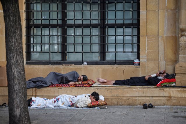 Displaced people sleep by a mosque, amid hostilities between Hezbollah and Israeli forces, in central Beirut, Lebanon on October 16, 2024. (Photo by Louisa Gouliamaki/Reuters)