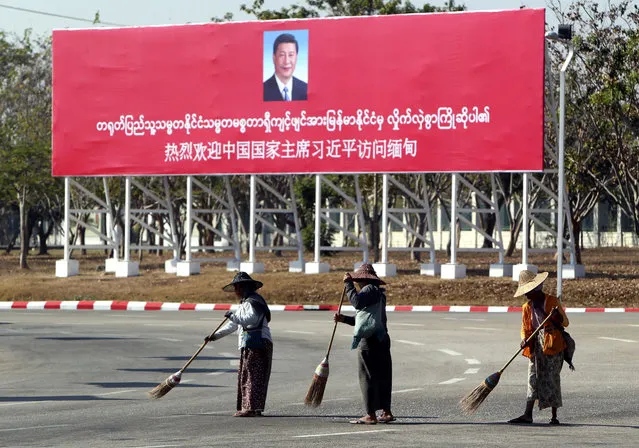 Municipal workers sweep on a road near a welcoming billboard to Chinese President Xi Jinping Friday, January 17, 2020, in Naypyitaw, Myanmar. China's President Xi Jinping was heading to Myanmar on Friday for a state visit likely to deepen the countries' already close bilateral relations at a critical time. (Photo by Aung Shine Oo/AP Photo)