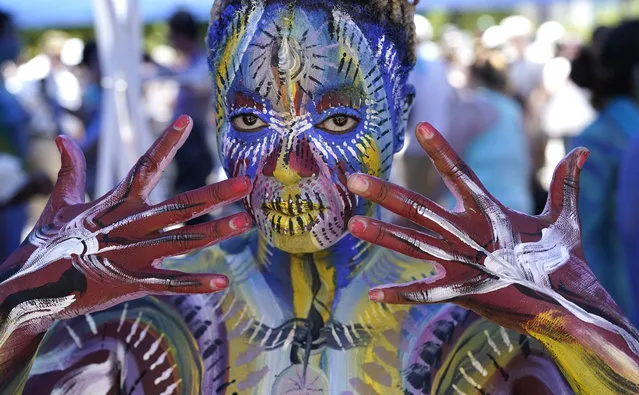 People participate in the the 9th annual NYC Bodypainting Day at Union Square in New York on July 24, 2022  The event is organized by Ne York-based artist Andy Golub. (Photo by Timothy A. Clary/AFP Photo)