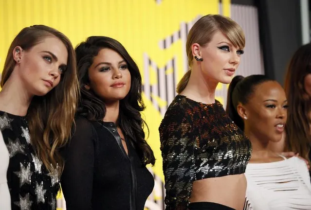 From left, model Cara Delevingne, recording artists Selena Gomez and Taylor Swift and actress Serayah McNeill arrive at the 2015 MTV Video Music Awards in Los Angeles, California, August 30, 2015. (Photo by Danny Moloshok/Reuters)
