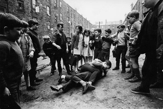 Street fighting in the Gorbals in Glasgow, a port city on the River Clyde in Scotland's western Lowlands on May 18, 1968. (Photo by David Newell-Smith/GNM Archive/The Observer/The Guardian)
