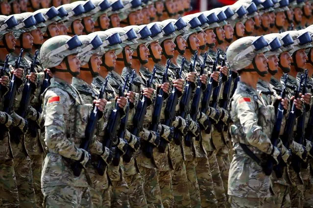 China's People's Liberation Army soldiers march with their weapons at Tiananmen Square during the military parade marking the 70th anniversary of the end of World War Two, in Beijing September 3, 2015. (Photo by Damir Sagolj/Reuters)