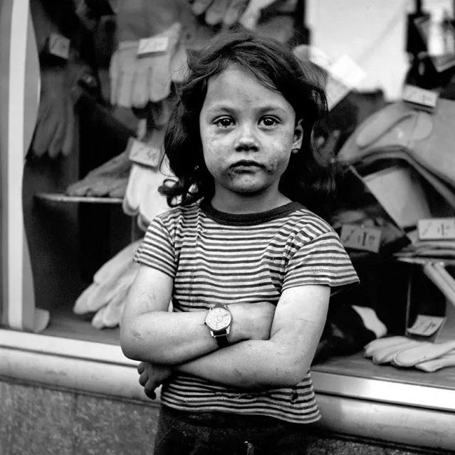 This 1950s photo provided by the Estate of Vivian Maier and John Maloof Collection shows a girl with a soiled face at an unknown location. (Photo by Vivian Maier/Estate of Vivian Maier and John Maloof Collection via AP Photo)