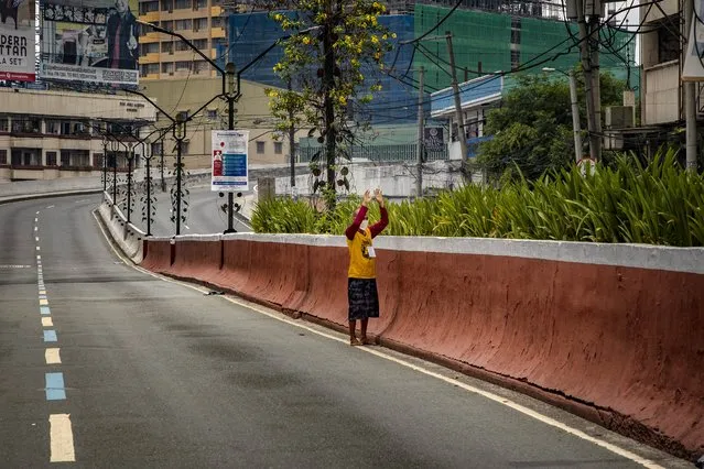 A Catholic devotee prays outside a closed church along an empty highway, defying government orders to avoid religious gatherings and stay home to curb the spread of the coronavirus, as he commemorates Good Friday on April 10, 2020 in Manila, Philippines. Good Friday is a Christian holiday commemorating the crucifixion of Jesus and his death at Calvary. It is observed during Holy Week on the Friday preceding Easter Sunday. Most Easter celebrations in the Philippines have been cancelled after religious gatherings have been banned as part of government lockdown measures imposed on the country's main island Luzon to curb the spread of the coronavirus. Land, sea, and air travel has been suspended, while government work, schools, businesses, and public transportation have been ordered shut in a bid to keep some 55 million people at home. The Philippines' Department of Health has so far confirmed 4,076 cases of the new coronavirus in the country, with at least 203 recorded fatalities. The Philippines is the only Roman Catholic majority in Southeast Asia with around 85% practicing the faith. (Photo by Ezra Acayan/Getty Images)