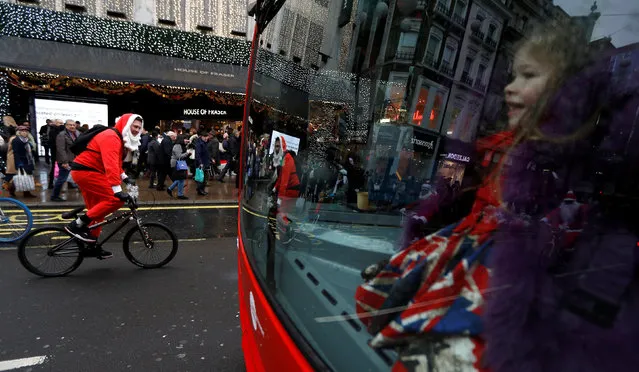 Santa's on BMX cycles take part in a charity ride along Oxford street in London, Britain December 16, 2017. (Photo by Peter Nicholls/Reuters)