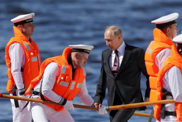 Russian President Vladimir Putin arrives to attend the military parade during the Navy Day celebration in St.Petersburg, Russia, Sunday, July 26, 2020. (Photo by Dmitri Lovetsky/AP Photo/Pool)