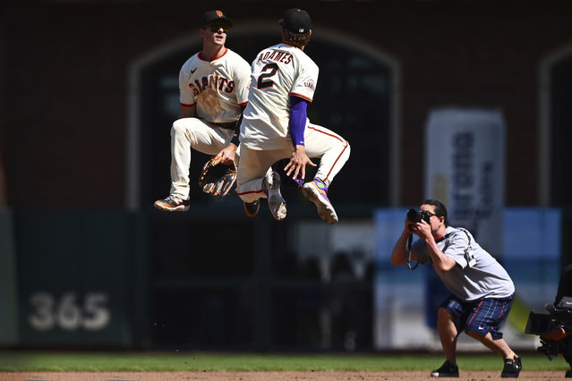San Francisco Giants' Mike Yastrzemski (5) celebrates with teammate Willy Adames (2) after defeating the Boston Red Sox in a baseball game, Sunday, June 22, 2025, in San Francisco. (Photo by Jose Carlos Fajardo/Bay Area News Group via AP Photo)