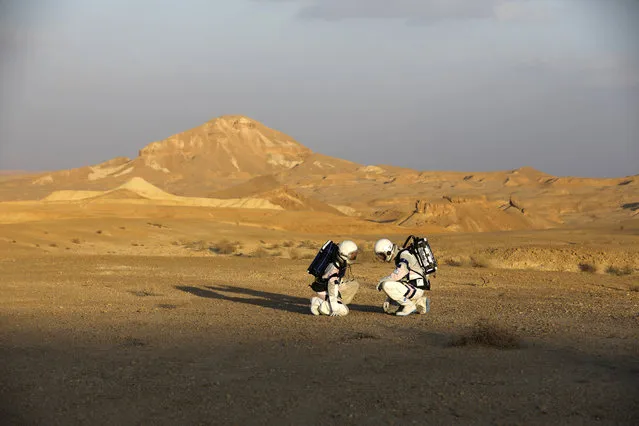 Israeli analog astronauts start their mission on the D-MARS Project on February 18, 2018, in cooperation with the Israel Space Agency, which simulates life on Mars by performing several scientific experiments and staying in the D-MARS (Desert Mars Analog Ramon Station) which is built in an isolated desert area south of Mitzpe Ramon, in the Israeli Negev desert, chosen for its similarities to Mars in terms of geology, aridity, and isolation. (Photo by Menahem Kahana/AFP Photo)