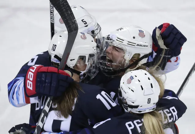 Gigi Marvin (19), of the United States, celebrates with her teammates after scoring a goal against Finland during the first period of the semifinal round of the women's hockey game at the 2018 Winter Olympics in Gangneung, South Korea, Monday, February 19, 2018. (Photo by Julio Cortez/AP Photo)