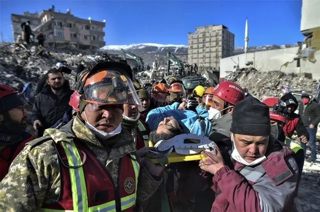 Turkish rescue workers from Kazakhstan and Turkey pull out Hatice Akar from a collapsed building 180 hours after the earthquake in Kahramanmaras, southern Turkey, early Monday, February 13, 2023. (Photo by IHA via AP Photo)