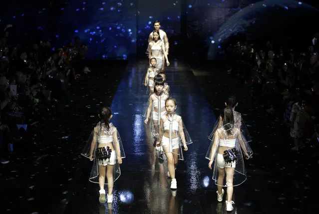 Models show off latest creations of Parent-Child outfits with the theme "Star Wars" designed by Liujia, during the China Fashion Week in Beijing, Friday, October 30, 2015. (Photo by Andy Wong/AP Photo)