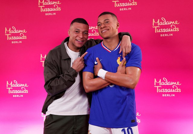 Paris Saint-Germain's French forward #07 Kylian Mbappe poses as he unveils his one-of-a-kind wax figure in Paris on May 16, 2024. Mbappe's one-of-a-kind wax figure will be taken to Berlin to be exhibited at Madame Tussauds in Berlin. (Photo by Gonzalo Fuentes/Reuters)