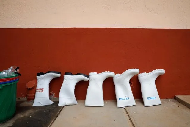 Boot used by medical staff are seen outside the coronavirus disease (COVID-19) ICU of Machakos Level 5 Hospital, in Machakos, Kenya on October 28, 2020. (Photo by Baz Ratner/Reuters)