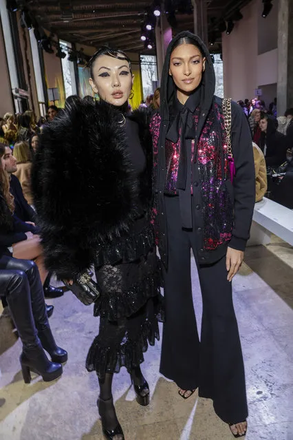 Fashion blogger Jessica Wang, left, and international model and fashion influencer Pritika Swarup pose for photographers at the Elie Saab Fall/Winter 2023-2024 ready-to-wear collection presented Saturday, March 4, 2023 in Paris. (Photo by Vianney Le Caer/Invision/AP Photo)