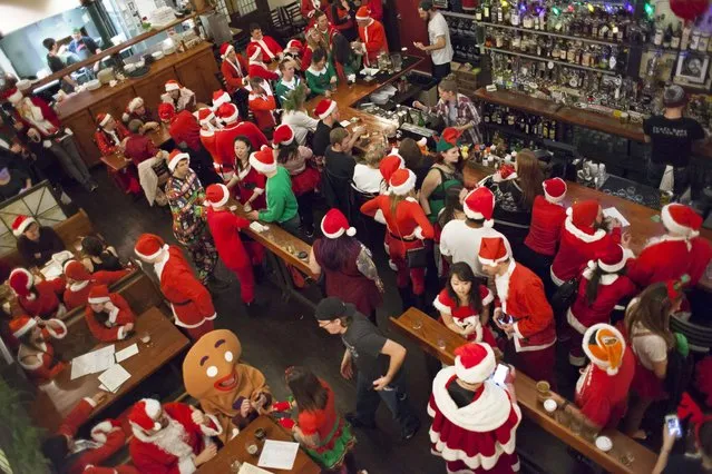 Santarchy participants fill The Pine Box in Seattle, Washington December 13, 2014. (Photo by David Ryder/Reuters)