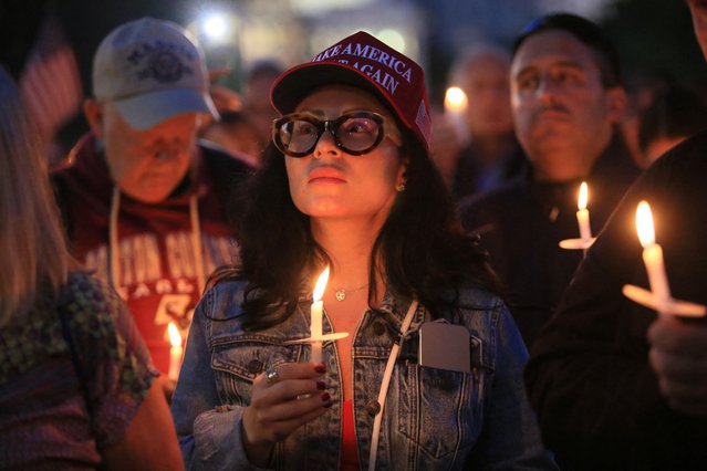 People hold candles and pray at a vigil for Charlie Kirk, a U.S. right-wing activist and commentator, and ally of U.S. President Donald Trump, who was killed on September 10, in Boston, Massachusetts, U.S., September 18, 2025. (Photo by Lauren Owens Lambert/Reuters)