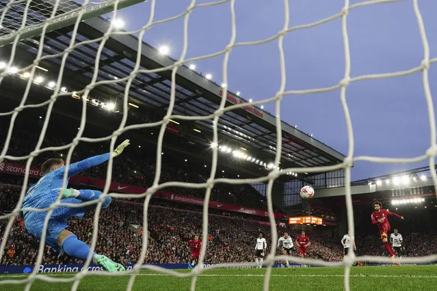 Liverpool's Mohamed Salah score his side's first goal on a penalty kick during the English Premier League soccer match between Liverpool and Fulham, at Anfield Stadium, Liverpool, England, Wednesday, May 3, 2023. (Photo by Jon Super/AP Photo)