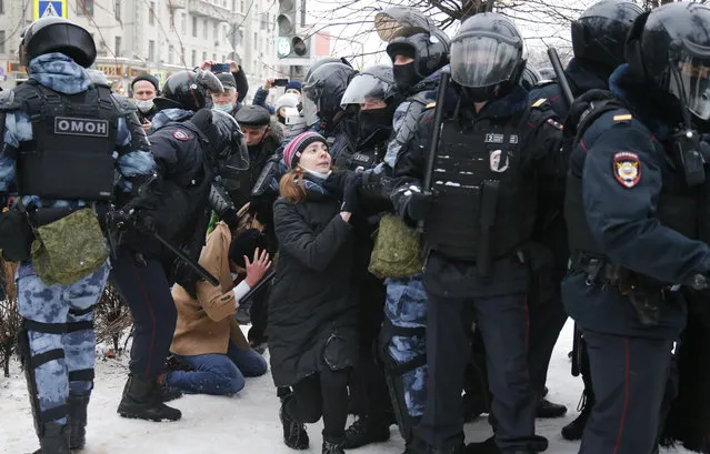 Police detain a man during a protest against the jailing of opposition leader Alexei Navalny in Moscow, Russia, Saturday, January 23, 2021. Russian police on Saturday arrested hundreds of protesters who took to the streets in temperatures as low as minus 50 C (minus-58 F) to demand the release of Alexei Navalny, the country's top opposition figure. A Navalny, President Vladimir Putin's most prominent foe, was arrested on Jan. 17 when he returned to Moscow from Germany, where he had spent five months recovering from a severe nerve-agent poisoning that he blames on the Kremlin. (Photo by Alexander Zemlianichenko/AP Photo)