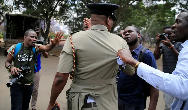 Journalists petition a senior policeman after they were attacked by riot policemen as they covered anti-corruption protesters opposing the graft and abuse of funds in public healthcare, during a demonstration in Kenya's capital Nairobi, November 3, 2016. (Photo by Thomas Mukoya/Reuters)