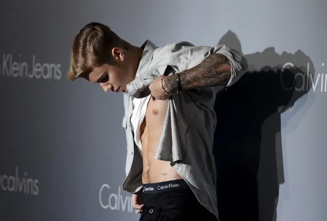 Justin Bieber shows off his Calvin Klein underwear as he attends a musical event hosted by Calvin Klein Jeans in Hong Kong, June 11, 2015. (Photo by Bobby Yip/Reuters)
