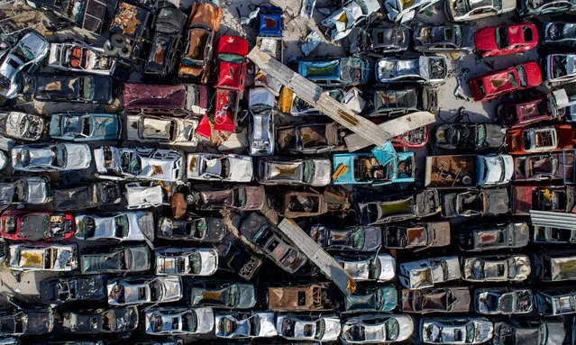 A picture taken with a drone shows imported and damaged vehicles at the destroyed port area at the six months mark since the day of the explosion, in Beirut, Lebanon, 03 February 2021. (Photo by Wael Hamzeh/EPA/EFE)