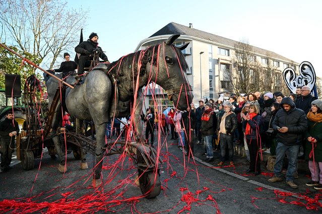 Members of the theatre company Paris Benares perform during a demonstration in Nantes, western France, on December 19, 2024, where the 2025 budget review began, to protest against the drastic cuts to culture and sport announced by the President of the Pays de la Loire region. The 2025 budget provides for drastic cuts in subsidies for culture, sport, community life and the economy, with a target savings of ß100 million. It also provides for the non-renewal of 100 posts within the Region's departments. (Photo by Sebastien Salom-Gomis/AFP Photo)